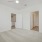 Large well lit bedroom with plush carpets and large windows 